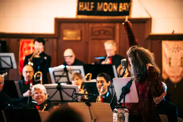 Singer Katie Lipka directing the band